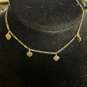 Heart ankle bracelet in silver finish scratch test says silver no marks.